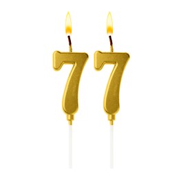 Image of Burning golden cake candles composing number 77 on white background. Festive decoration for birthday or other special date