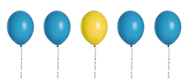 Image of Individuality, uniqueness, different. Yellow balloon among blue ones on white background