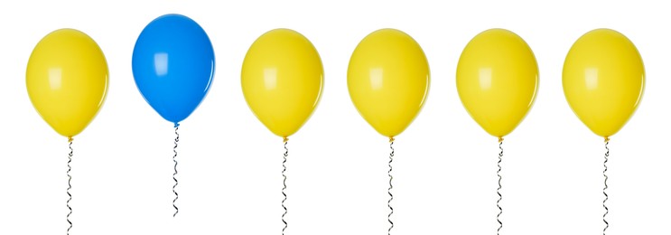 Image of Individuality, uniqueness, different. Blue balloon among yellow ones on white background