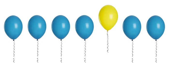 Image of Individuality, uniqueness, different. Yellow balloon among blue ones on white background