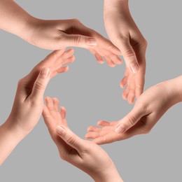Image of Making circle of human hands on grey background. Unity, partnership, cooperation