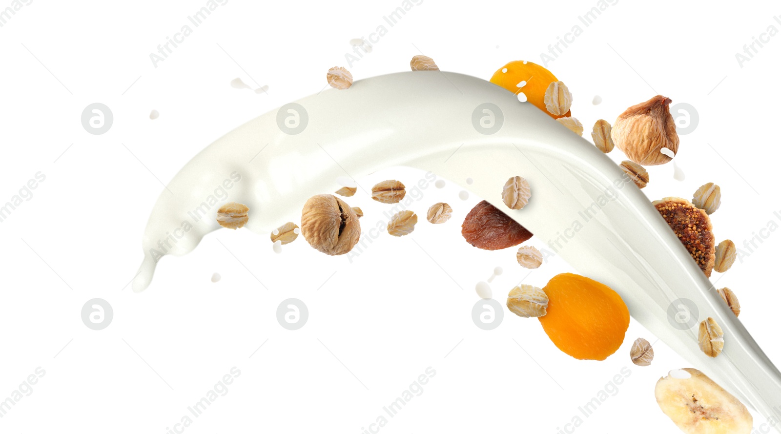 Milk splash with oat flakes and dried fruits in air on white background. Healthy breakfast Image of Milk splash with oat flakes and dried fruits in air on white background. Healthy breakfast