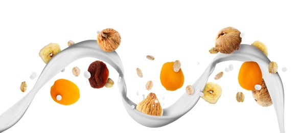 Image of Milk flow with oat flakes and dried fruits in air on white background. Healthy breakfast