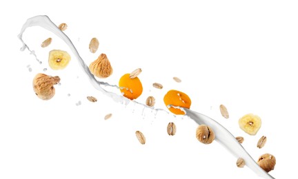 Image of Milk splash with oat flakes and dried fruits in air on white background. Healthy breakfast