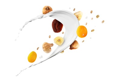 Image of Milk splash with oat flakes and dried fruits in air on white background. Healthy breakfast