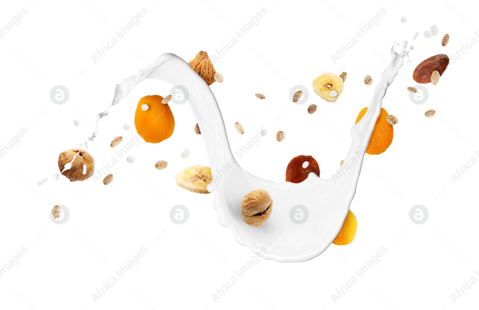 Milk splash with oat flakes and dried fruits in air on white background. Healthy breakfast Image of Milk splash with oat flakes and dried fruits in air on white background. Healthy breakfast