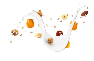Image of Milk splash with oat flakes and dried fruits in air on white background. Healthy breakfast