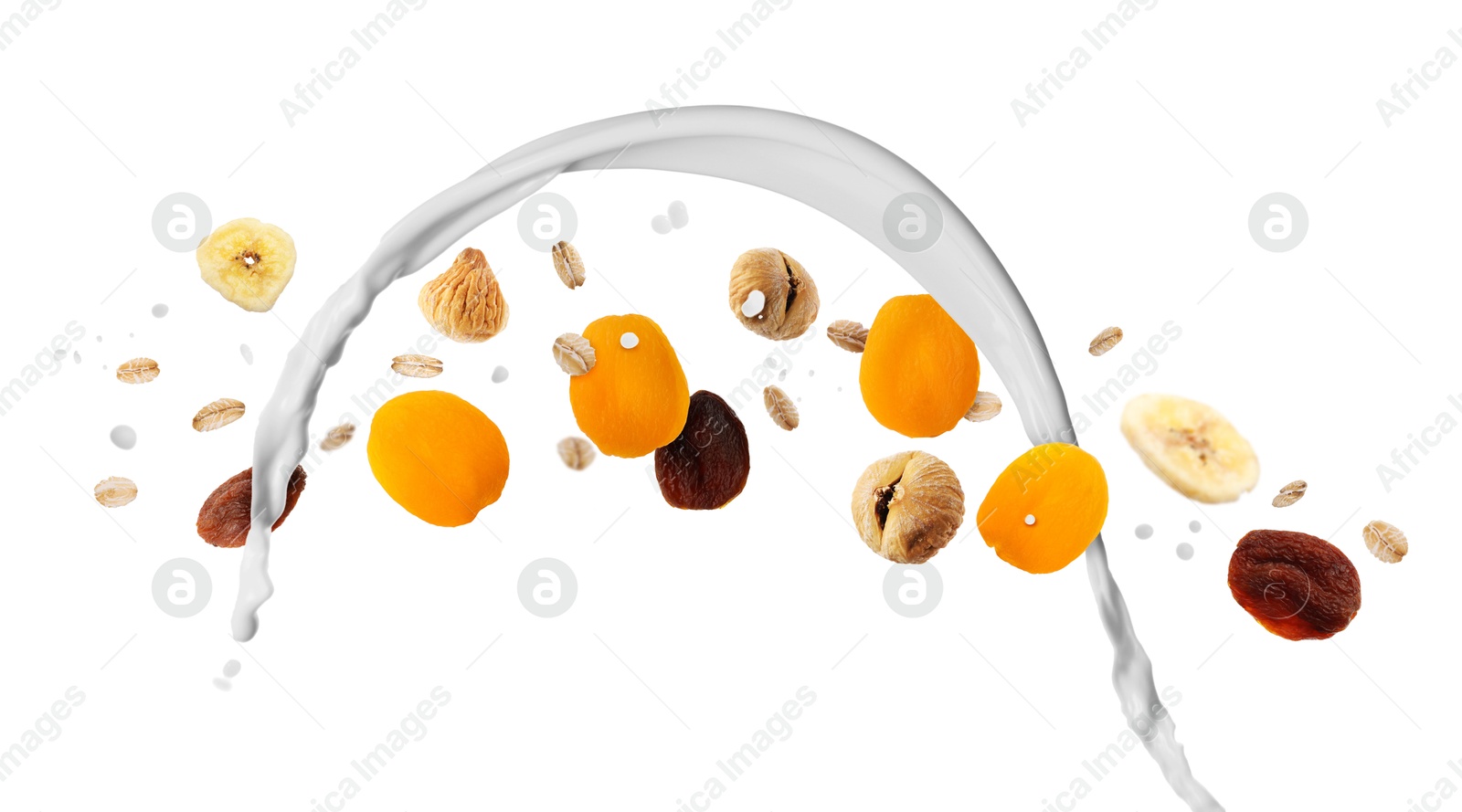 Milk splash with oat flakes and dried fruits in air on white background. Healthy breakfast Image of Milk splash with oat flakes and dried fruits in air on white background. Healthy breakfast