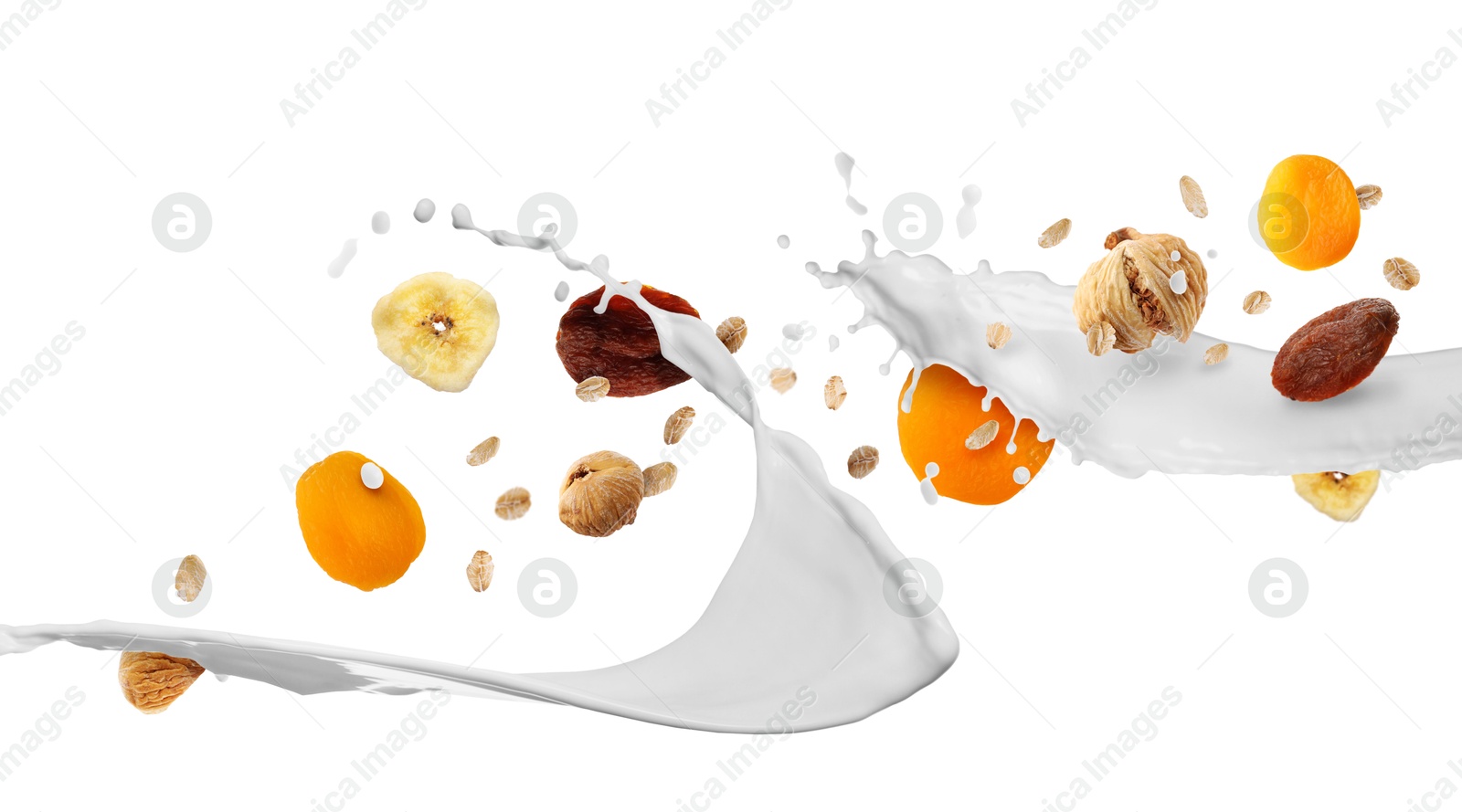 Milk splash with oat flakes and dried fruits in air on white background. Healthy breakfast Image of Milk splash with oat flakes and dried fruits in air on white background. Healthy breakfast
