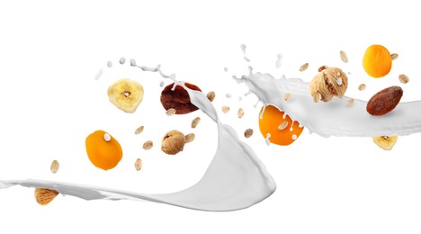 Image of Milk splash with oat flakes and dried fruits in air on white background. Healthy breakfast