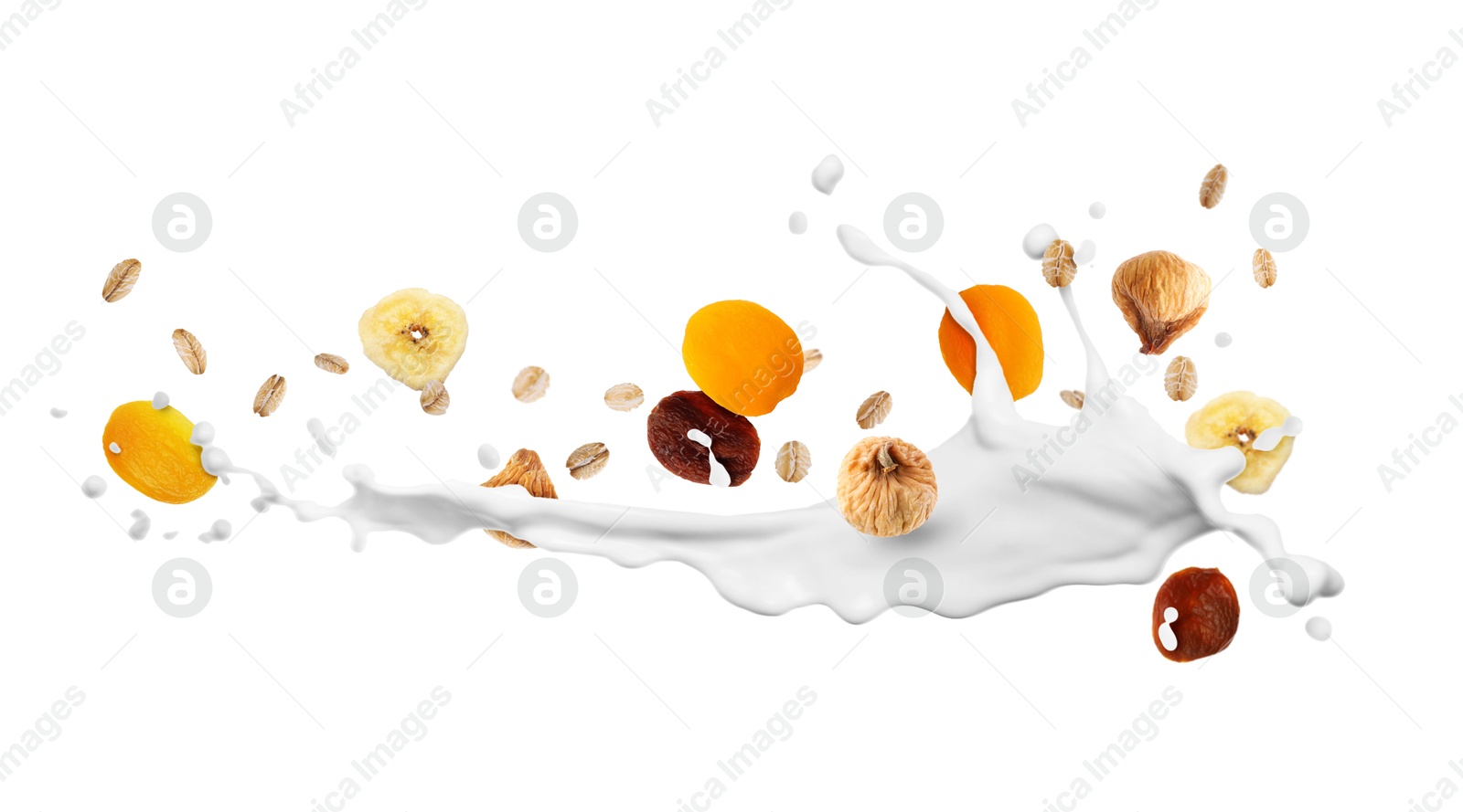 Milk splash with oat flakes and dried fruits in air on white background. Healthy breakfast Image of Milk splash with oat flakes and dried fruits in air on white background. Healthy breakfast