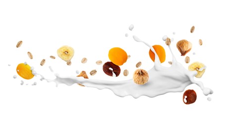 Image of Milk splash with oat flakes and dried fruits in air on white background. Healthy breakfast