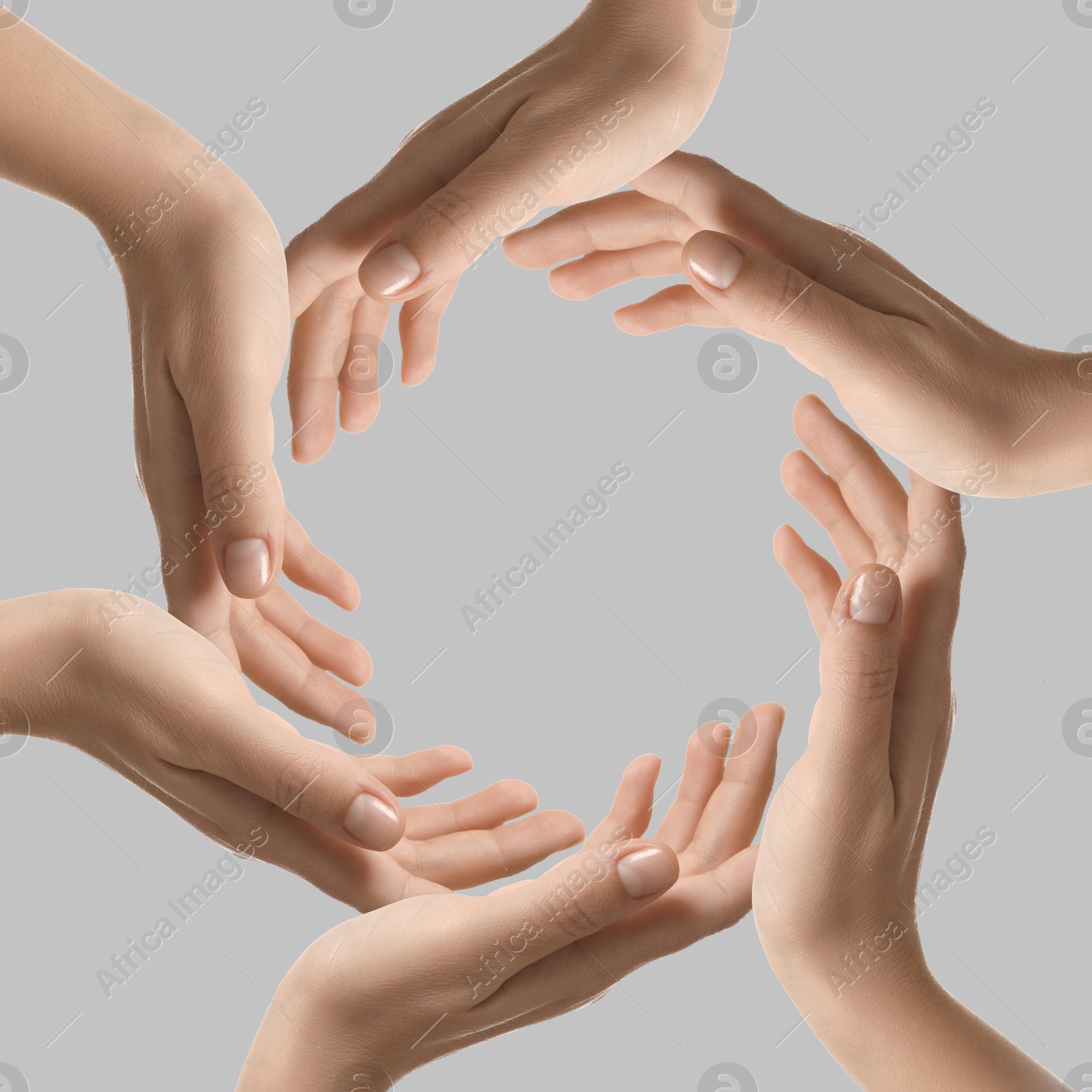 Making circle of human hands on grey background. Unity, partnership, cooperation Image of Making circle of human hands on grey background. Unity, partnership, cooperation