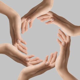 Image of Making circle of human hands on grey background. Unity, partnership, cooperation