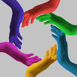 Image of Making circle of human hands painted in different colors on grey background. Unity, partnership, cooperation