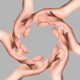 Image of Making circle of human hands on grey background. Unity, partnership, cooperation