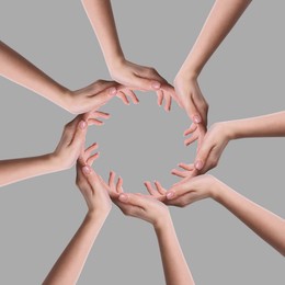 Image of Making circle of human hands on grey background. Unity, partnership, cooperation