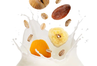 Image of Milk splash with oat flakes and dried fruits in air on white background. Healthy breakfast