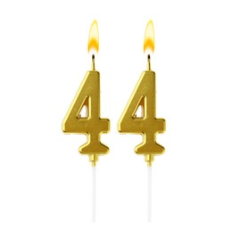 Image of Burning golden cake candles composing number 44 on white background. Festive decoration for birthday or other special date