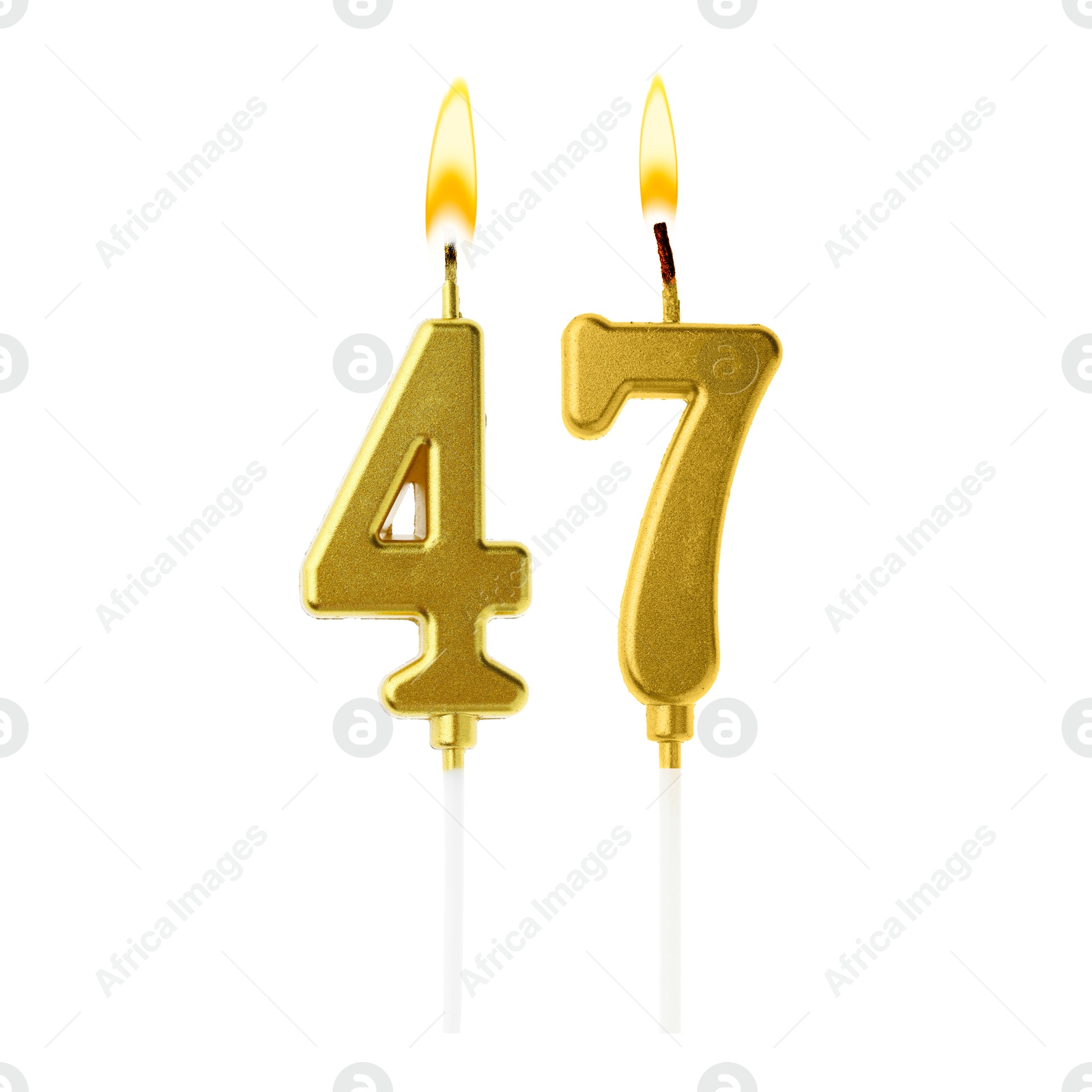Burning golden cake candles composing number 47 on white background. Festive decoration for birthday or other special date Image of Burning golden cake candles composing number 47 on white background. Festive decoration for birthday or other special date