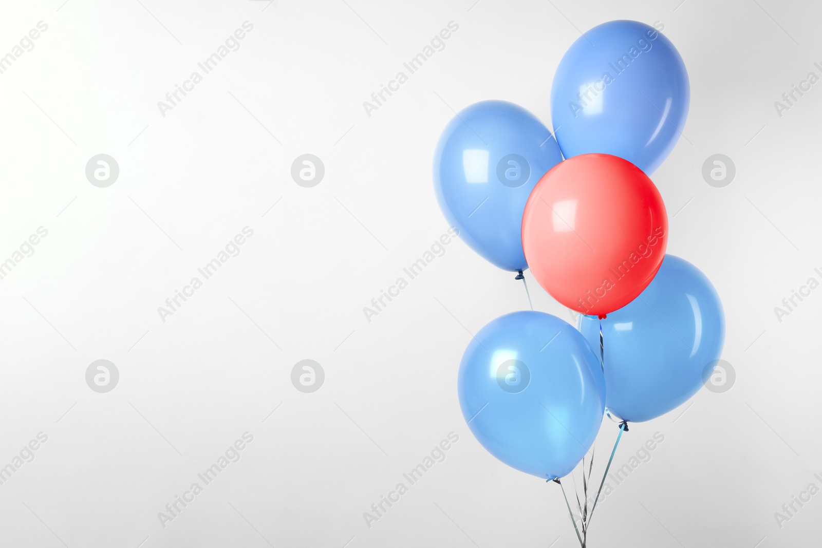 Individuality, uniqueness, different. Red balloon among blue ones on white background Image of Individuality, uniqueness, different. Red balloon among blue ones on white background