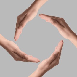 Image of Making circle of human hands on grey background. Unity, partnership, cooperation