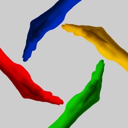 Image of Making circle of human hands painted in different colors on grey background. Unity, partnership, cooperation