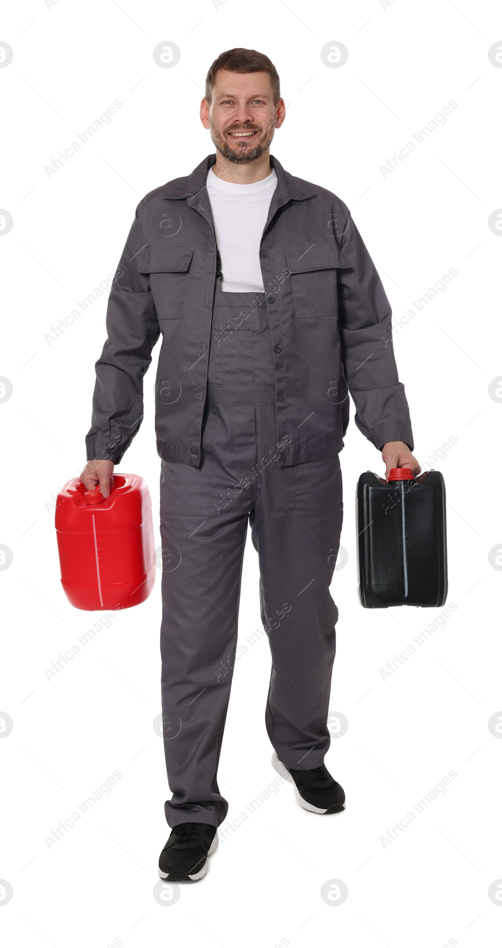 Man with plastic canisters on white background Photo of Man with plastic canisters on white background