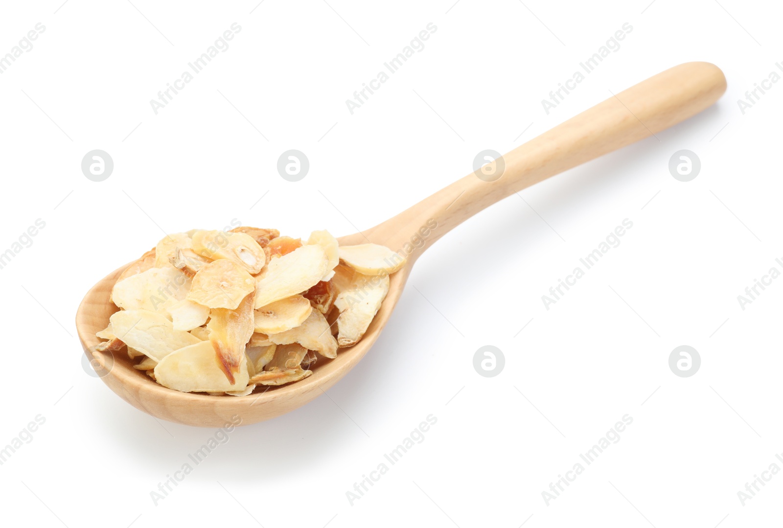 Dried garlic in wooden spoon isolated on white Photo of Dried garlic in wooden spoon isolated on white