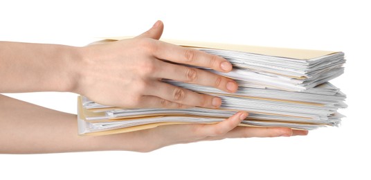 Photo of Woman holding stack of file folders with papers on white background, closeup