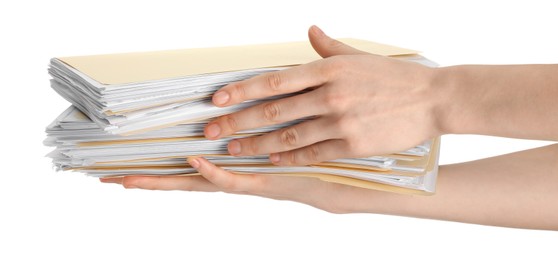 Photo of Woman holding stack of file folders with papers on white background, closeup