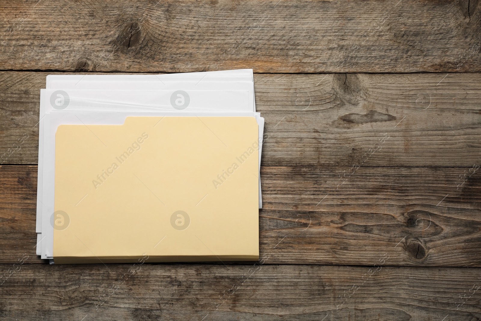 File folder with papers on wooden table, top view. Space for text Photo of File folder with papers on wooden table, top view. Space for text