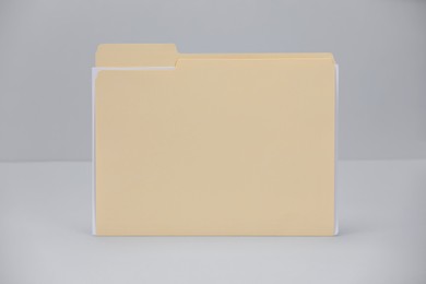 Photo of One paper file folder on gray background