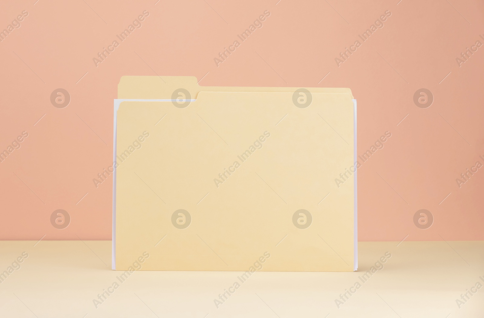 One paper file folder on color background Photo of One paper file folder on color background