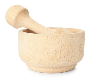 Photo of Wooden mortar with pestle isolated on white