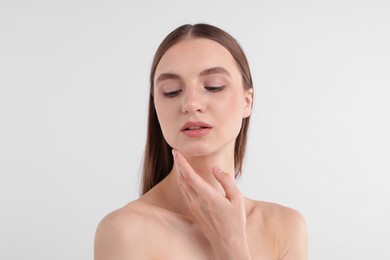 Photo of Portrait of attractive young woman on white background