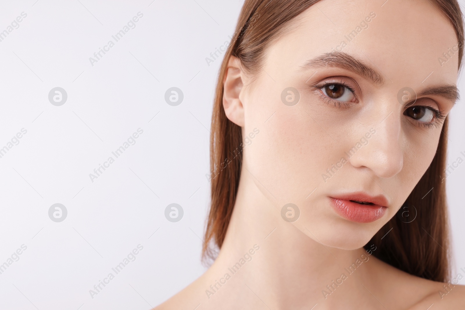 Portrait of attractive young woman on white background, closeup. Space for text Photo of Portrait of attractive young woman on white background, closeup. Space for text