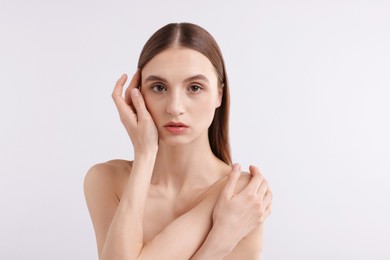 Photo of Portrait of attractive young woman on white background