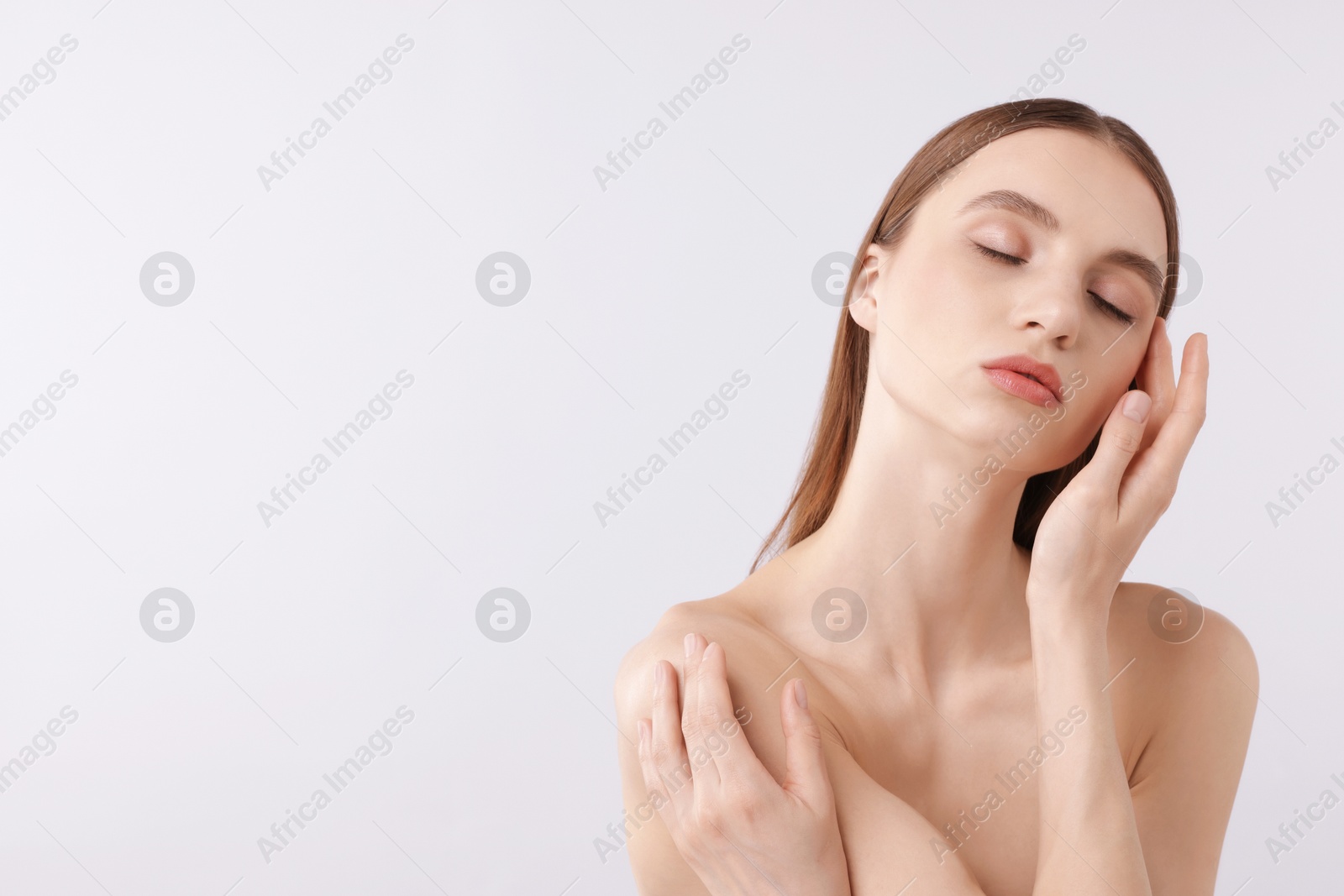 Portrait of attractive young woman on white background. Space for text Photo of Portrait of attractive young woman on white background. Space for text
