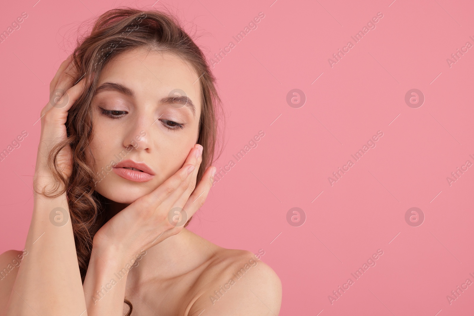 Portrait of beautiful young woman on pink background. Space for text Photo of Portrait of beautiful young woman on pink background. Space for text