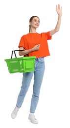 Photo of Woman with plastic shopping basket waving on white background
