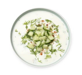 Photo of Tasty cucumber soup with dill and nuts in bowl isolated on white, top view