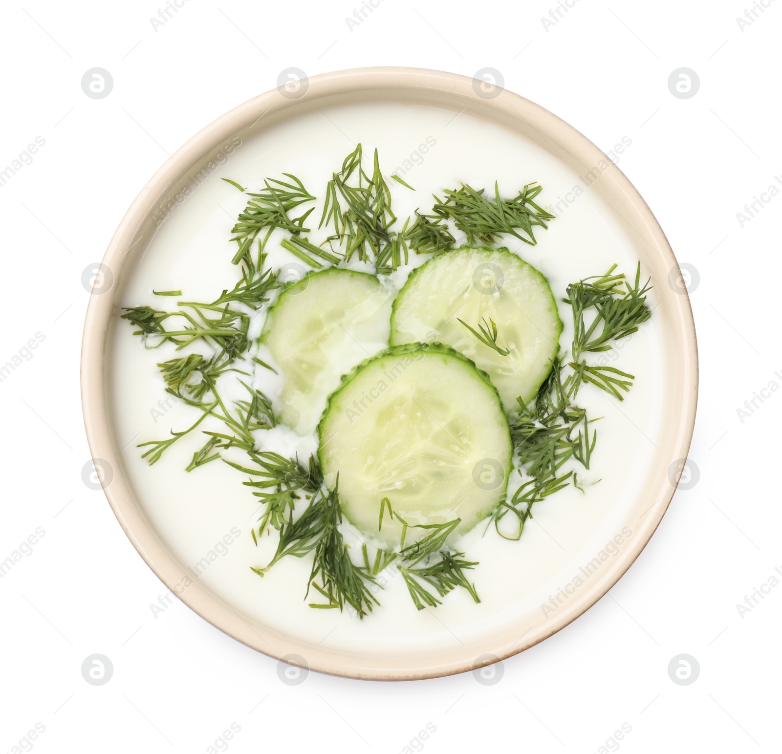 Tasty cucumber soup with dill in bowl isolated on white, top view Photo of Tasty cucumber soup with dill in bowl isolated on white, top view
