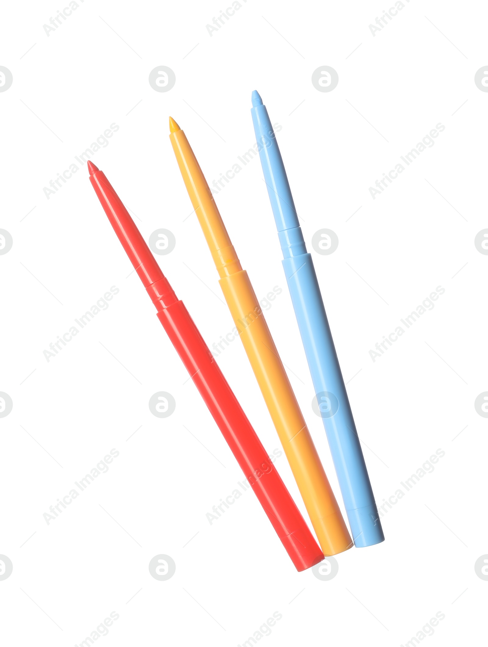 Bright twist up eye pencils isolated on white Photo of Bright twist up eye pencils isolated on white