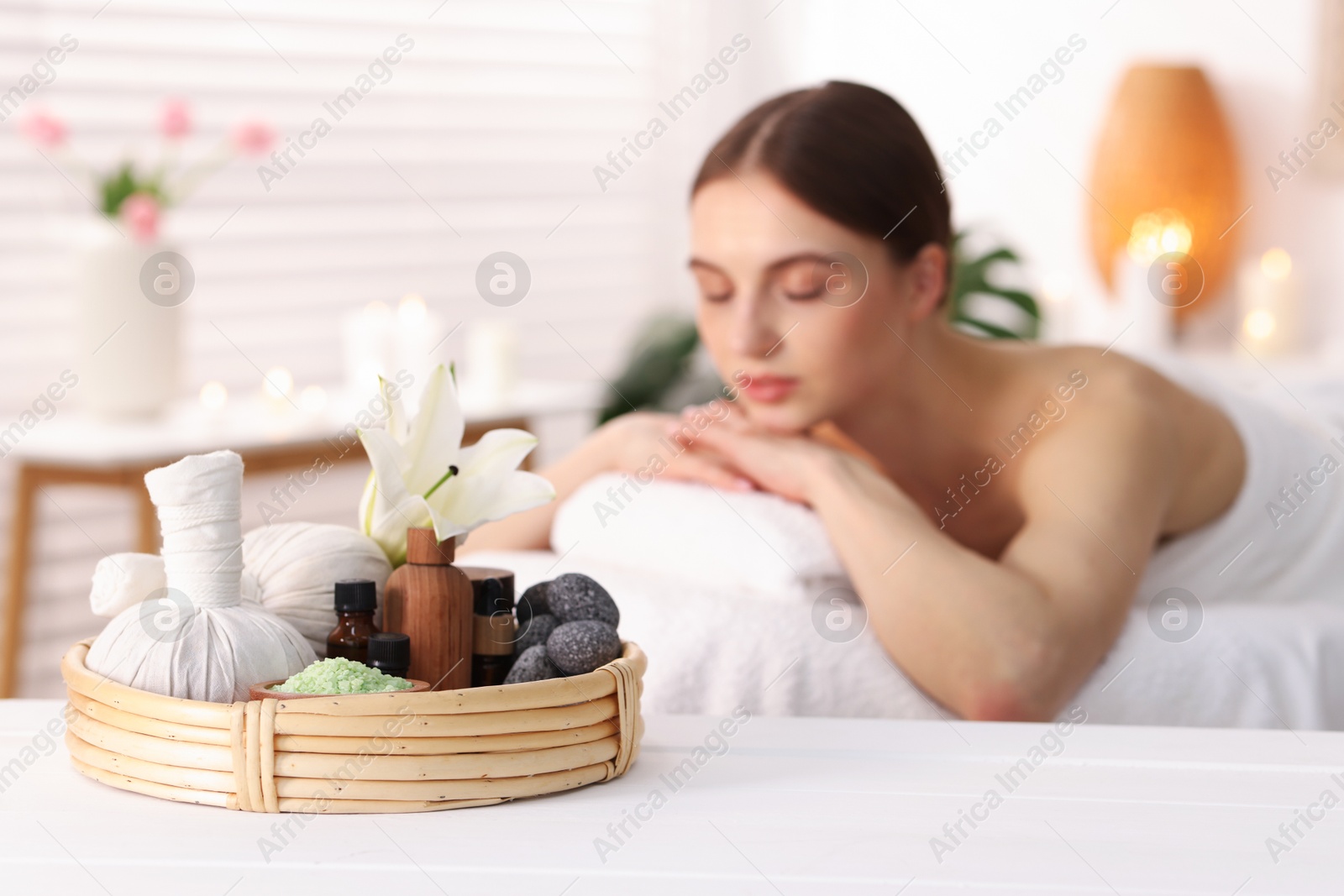 Beautiful woman relaxing on massage couch in spa salon, selective focus Photo of Beautiful woman relaxing on massage couch in spa salon, selective focus