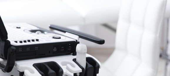 Photo of Modern ultrasound machine in clinic, closeup. Medical equipment