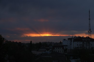 Photo of Beautiful view of city under sky lit by sunset