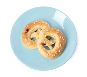 Photo of Cockroaches crawling on salted pretzels against white background, top view