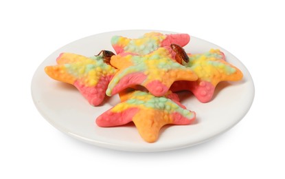 Photo of Cockroaches crawling on gummy candies against white background