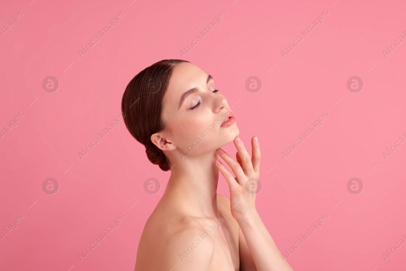Portrait of beautiful young woman on pink background. Space for text Photo of Portrait of beautiful young woman on pink background. Space for text